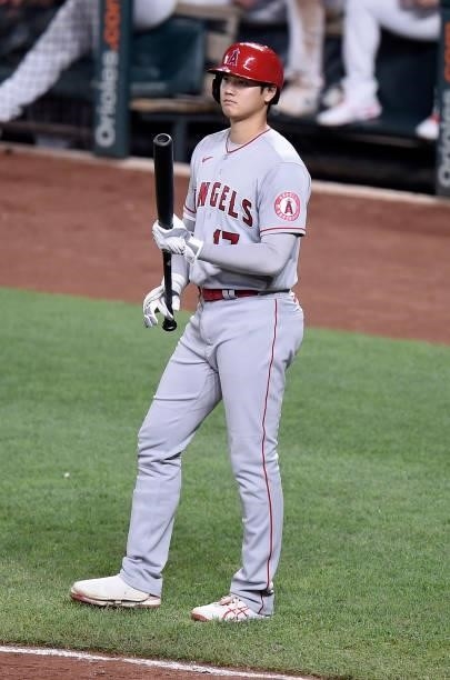 Shohei Ohtani of the Los Angeles Angels waits to bat in the eighth inning against the Baltimore Orioles at Oriole Park at Camden Yards on August 24,...