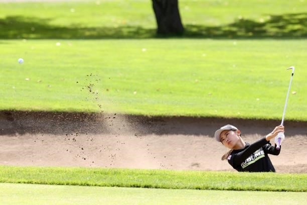 Yuka Yasuda of Japan hits out from a bunker on the 14th hole during the first round of the Nitori Ladies at Otaru Country Club on August 26, 2021 in...