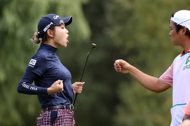 Akira Yamaji of Japan celebrates the birdie with her caddie on the 2nd green during the first round of the Nitori Ladies at Otaru Country Club on...