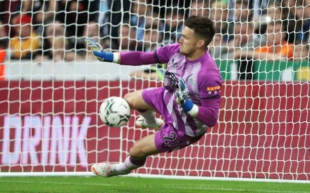 Freddie Woodman of Newcastle United saves a penalty in the shootout during the Carabao Cup Second Round match between Newcastle United and Burnley at...
