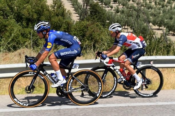 Andrea Bagioli of Italy and Team Deceuninck - Quick-Step and Juan Pedro López of Spain and Team Trek - Segafredo compete during the 76th Tour of...
