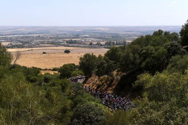 General view of the peloton beginning to climb the Alto de San Jerónimo during the 76th Tour of Spain 2021, Stage 12 a 175 km stage from Jaén to...
