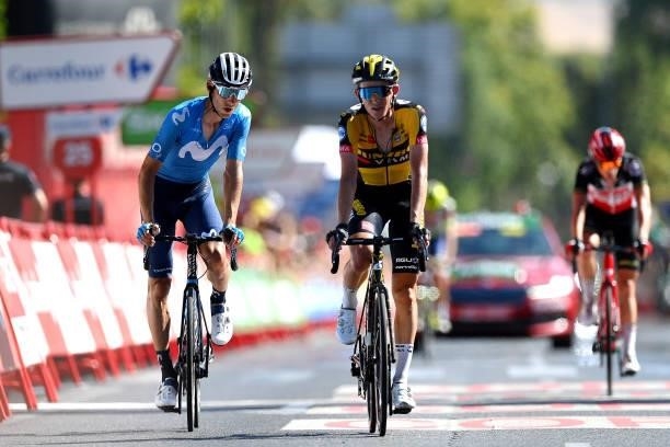 Carlos Verona Quintanilla of Spain and Movistar Team and Koen Bouwman of Netherlands and Team Jumbo - Visma cross the finishing line during the 76th...