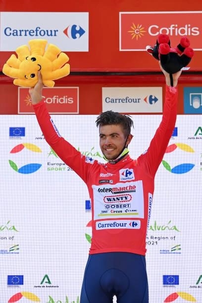 Odd Christian Eiking of Norway and Team Intermarché - Wanty - Gobert Matériaux celebrates winning the red leader jersey on the podium ceremony after...