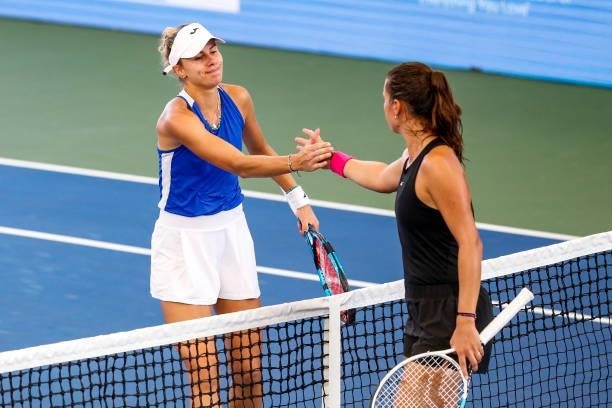 Magda Linette of Poland and Daria Kasatkina of Russia shake hands after their quarterfinal match on day 5 of the Cleveland Championships at Jacobs...