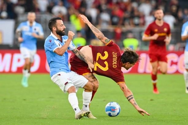 Nicolò Zaniolo of AS Roma fights for the ball with Manolis Siopis of Trabzonspor during the UEFA Conference League Play-Offs Leg Two match between AS...