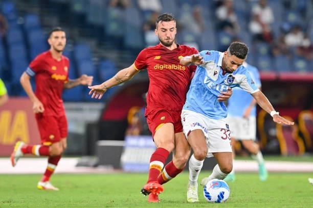 Bryan Cristante of AS Roma and Bruno Peres of Trabzonspor fight for the ball during the UEFA Conference League Play-Offs Leg Two match between AS...
