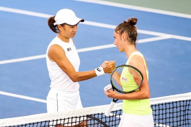 Shuai Zhang of China shakes hands with Sara Sorribes Tormo of Spain after their quarterfinal match on day 5 of the Cleveland Championships at Jacobs...