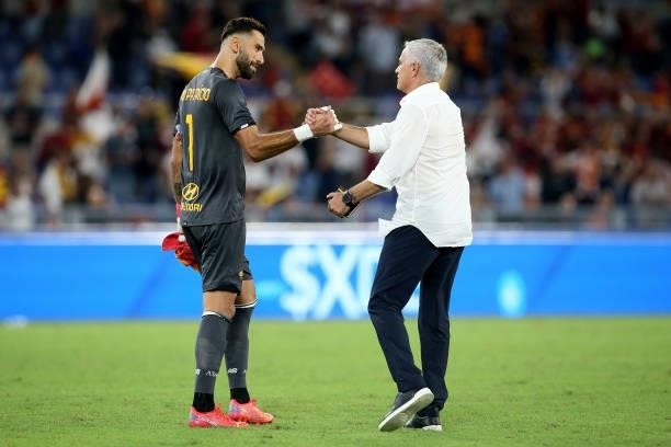 Coach Jose Mourinho of AS Roma greets his goalkeeper Rui Patricio after winning the UEFA Conference League Play-Offs Leg Two match between AS Roma...
