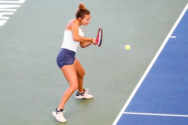 Elixane Lechemia of France returns a serve during the first set of her doubles match against Ulrikke Eikeri of Norway and Catherine Harrison of USA...