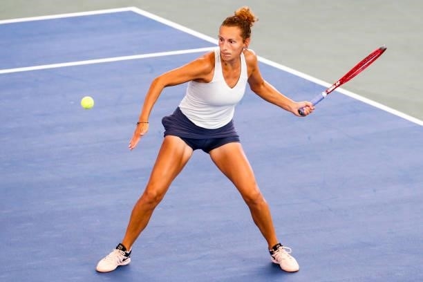 Elixane Lechemia of France returns the ball during the first set of her doubles match against Ulrikke Eikeri of Norway and Catherine Harrison of USA...