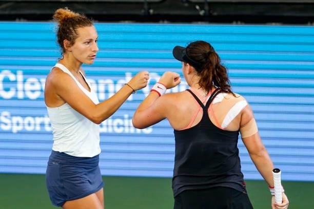 Elixane Lechemia of France fist bumps Ingrid Neel of USA during the second set of their doubles match against Ulrikke Eikeri of Norway and Catherine...