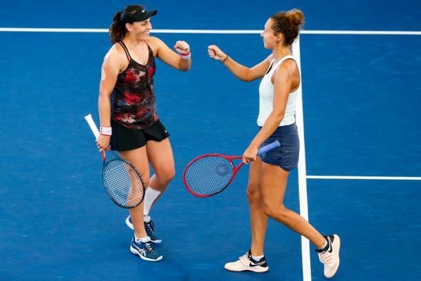 Ingrid Neel of USA fist bumps Elixane Lechemia of France during the second set of their doubles match against Ulrikke Eikeri of Norway and Catherine...