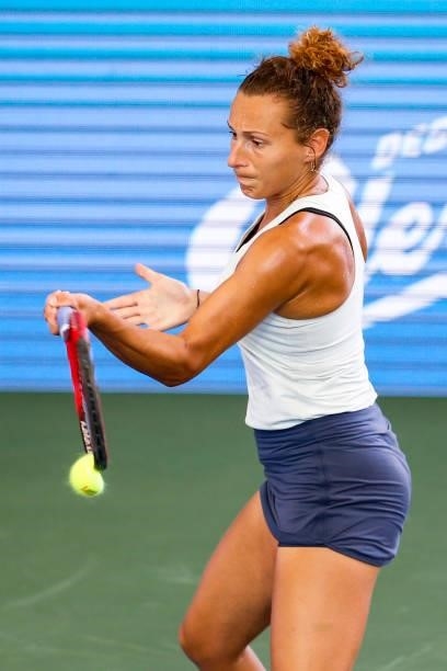 Elixane Lechemia of France tips the ball during the second set of her doubles match against Ulrikke Eikeri of Norway and Catherine Harrison of USA on...