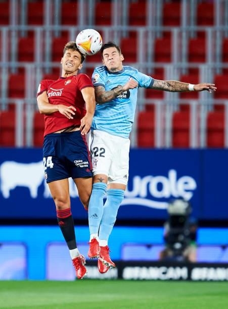 Santi Mina of Celta de Vigo duels for the ball with Lucas Torro of CA Osasuna during the La Liga Santader match between CA Osasuna and RC Celta de...