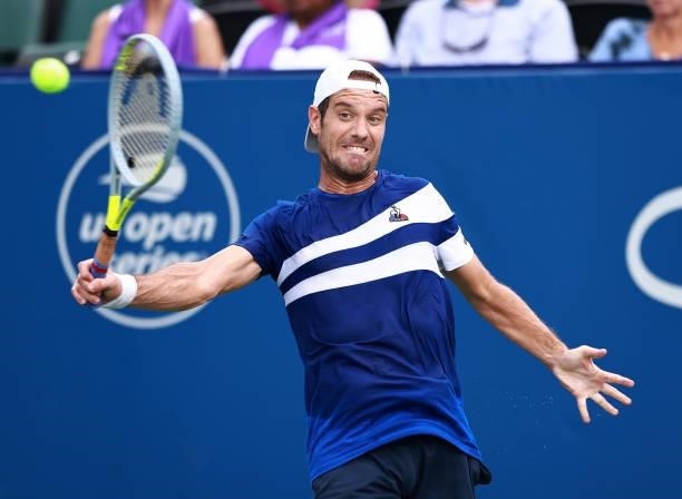 Richard Gasquet of France returns a shot to Emil Ruusuvuori of Finland in the quarterfinals of the Winston-Salem Open at Wake Forest Tennis Complex...