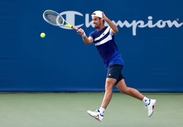 Richard Gasquet of France returns a shot to Emil Ruusuvuori of Finland in the quarterfinals of the Winston-Salem Open at Wake Forest Tennis Complex...