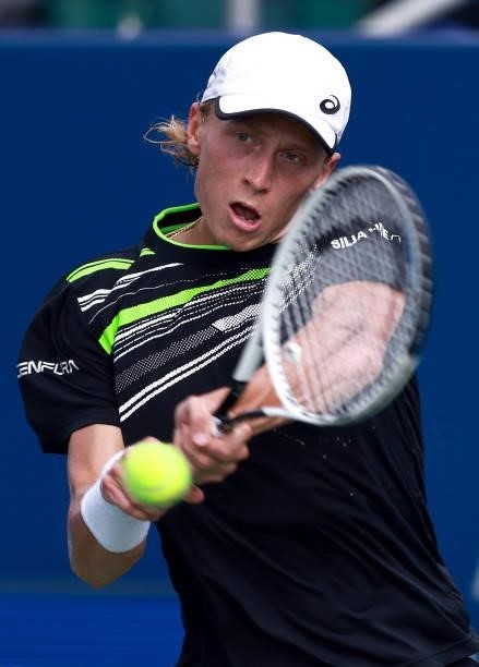 Emil Ruusuvuori of Finland returns a shot to Richard Gasquet of France in the quarterfinals of the Winston-Salem Open at Wake Forest Tennis Complex...