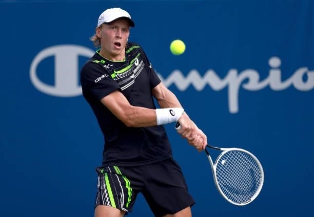 Emil Ruusuvuori of Finland returns a shot to Richard Gasquet of France in the quarterfinals of the Winston-Salem Open at Wake Forest Tennis Complex...