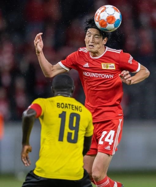 Genki Haraguchi of 1.FC Union Berlin jumps for a header with Boateng of Kuopion PS during the UEFA Conference League Play-Offs Leg Two match between...