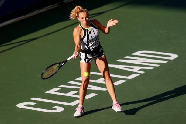 Katerina Siniakova of the Czech Republic returns a serve during the first set of her quarterfinal match against Anett Kontaveit of Estonia on day 5...