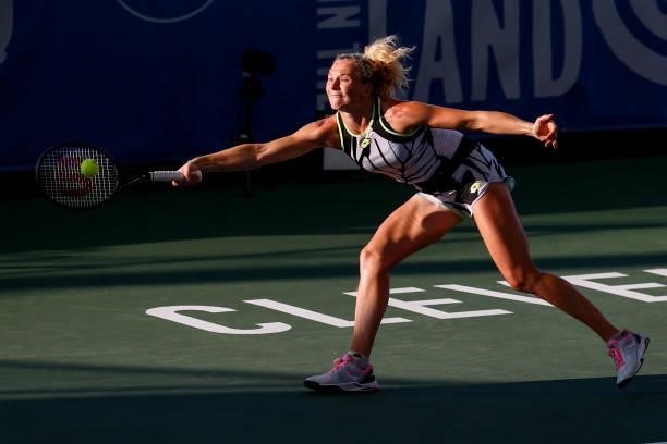 Katerina Siniakova of the Czech Republic dives for the ball during the first set of her quarterfinal match against Anett Kontaveit of Estonia on day...