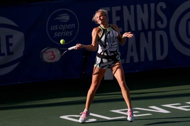 Katerina Siniakova of the Czech Republic returns a serve during the first set of her quarterfinal match against Anett Kontaveit of Estonia on day 5...