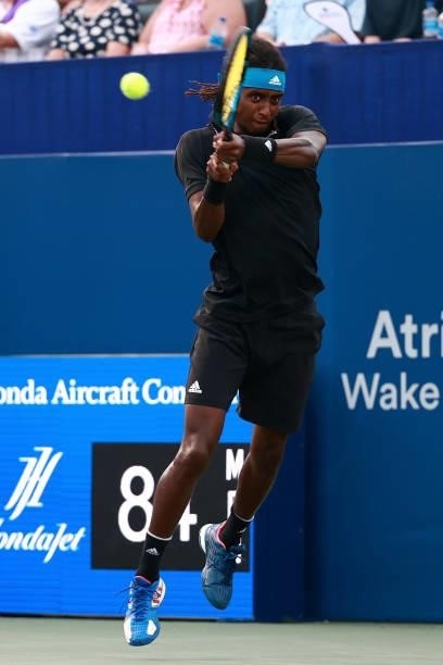 Mikael Ymer of Sweden returns a shot to Frances Tiafoe in the quarterfinals of the Winston-Salem Open at Wake Forest Tennis Complex on August 26,...