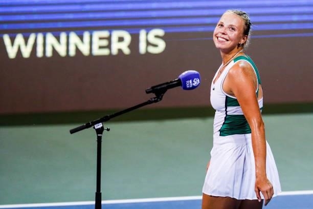 Anett Kontaveit of Estonia smiles at fans after winning in the third set of her quarterfinal match against Katerina Siniakova of the Czech Republic...