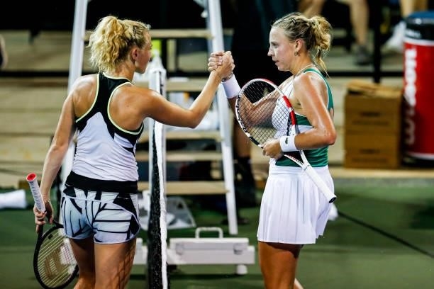 Anett Kontaveit of Estonia shakes hands with Katerina Siniakova of the Czech Republic after their quarterfinal match on day 5 of the Cleveland...