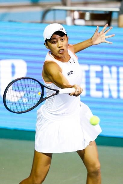 Shuai Zhang of China returns a serve during the first set of her quarterfinal doubles match against Christina McHale of USA and Sania Mirza of...