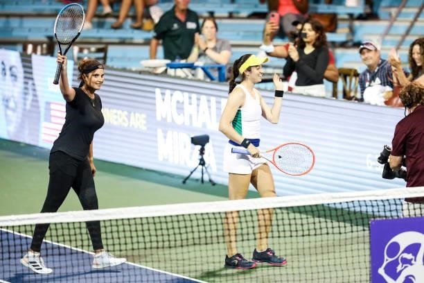 Sania Mirza of India and Christina McHale of USA wave to fans after winning their quarterfinal doubles match against Shuai Zhang of China and Lucie...