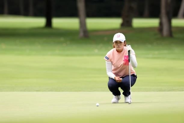Mone Inami of Japan lines up a putt on the 5th green during the second round of the Nitori Ladies at Otaru Country Club on August 27, 2021 in Otaru,...