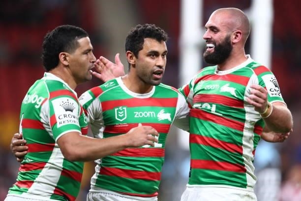 Alex Johnston of the Rabbitohs celebrates with team mates after scoring a try during the round 24 NRL match between the Sydney Roosters and the South...