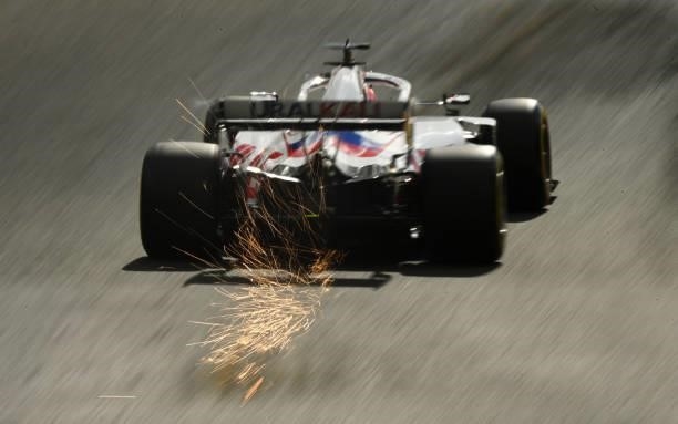 Sparks fly behind Nikita Mazepin of Russia driving the Haas F1 Team VF-21 Ferrari during practice ahead of the F1 Grand Prix of Belgium at Circuit de...