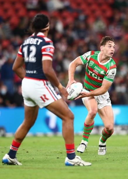 Cameron Murray of the Rabbitohs offloads the ball during the round 24 NRL match between the Sydney Roosters and the South Sydney Rabbitohs at Suncorp...