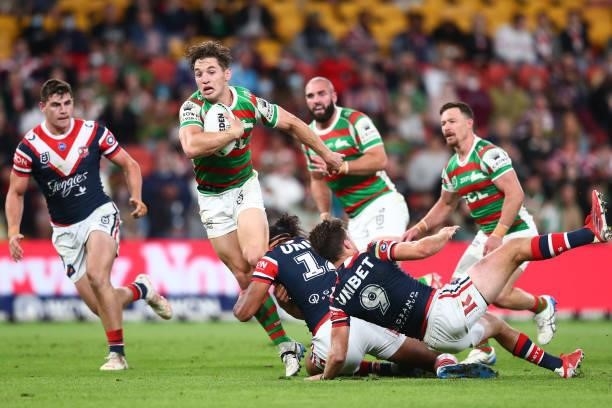 Cameron Murray of the Rabbitohs is tackled during the round 24 NRL match between the Sydney Roosters and the South Sydney Rabbitohs at Suncorp...