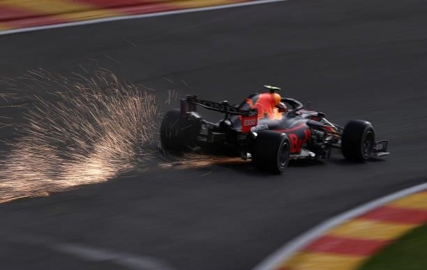 Sparks fly behind Sergio Perez of Mexico driving the Red Bull Racing RB16B Honda during practice ahead of the F1 Grand Prix of Belgium at Circuit de...