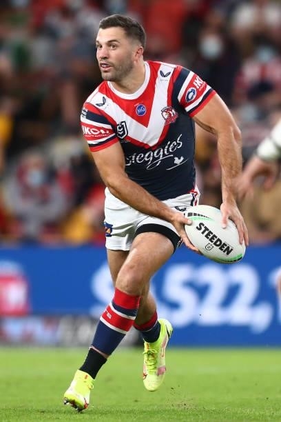 James Tedesco of the Roosters offloads the ball during the round 24 NRL match between the Sydney Roosters and the South Sydney Rabbitohs at Suncorp...