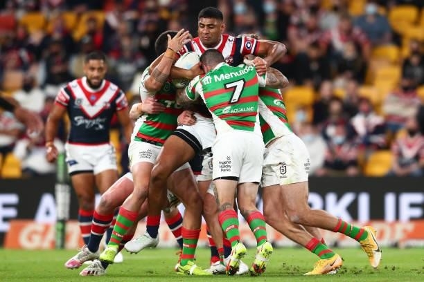 Daniel Tupou of the Roosters is tackled during the round 24 NRL match between the Sydney Roosters and the South Sydney Rabbitohs at Suncorp Stadium...