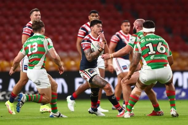 Brad Abbey of the Roosters is tackled during the round 24 NRL match between the Sydney Roosters and the South Sydney Rabbitohs at Suncorp Stadium on...