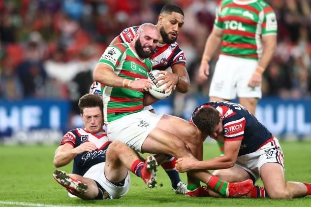 Mark Nicholls of the Rabbitohs is tackled during the round 24 NRL match between the Sydney Roosters and the South Sydney Rabbitohs at Suncorp Stadium...