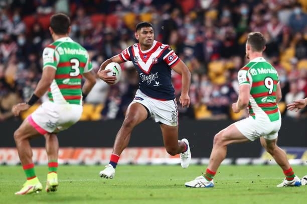 Daniel Tupou of the Roosters runs the ball during the round 24 NRL match between the Sydney Roosters and the South Sydney Rabbitohs at Suncorp...