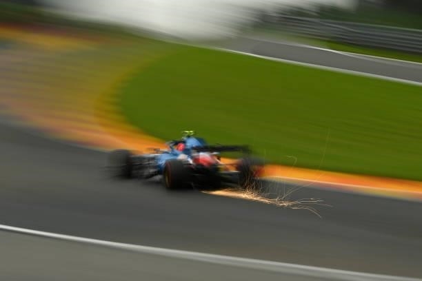 Sparks fly behind Esteban Ocon of France driving the Alpine A521 Renault during practice ahead of the F1 Grand Prix of Belgium at Circuit de...