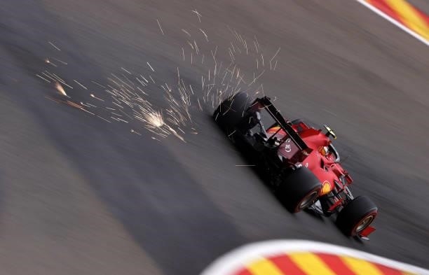 Sparks fly behind Carlos Sainz of Spain driving the Scuderia Ferrari SF21 during practice ahead of the F1 Grand Prix of Belgium at Circuit de...