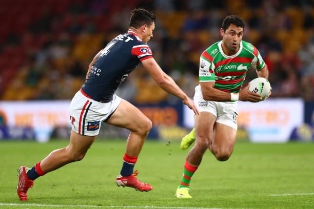 Alex Johnston of the Rabbitohs runs the ball during the round 24 NRL match between the Sydney Roosters and the South Sydney Rabbitohs at Suncorp...