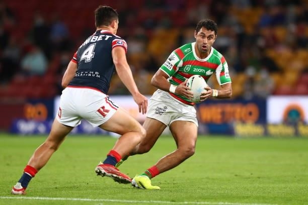 Alex Johnston of the Rabbitohs runs the ball during the round 24 NRL match between the Sydney Roosters and the South Sydney Rabbitohs at Suncorp...