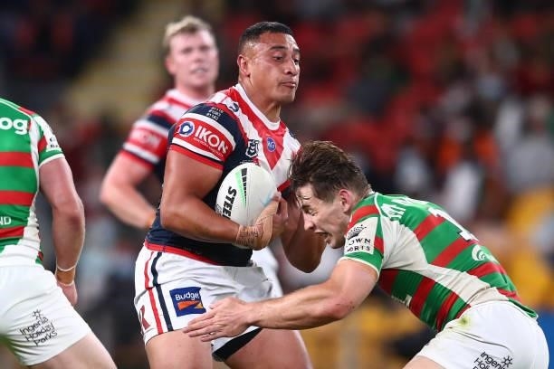 Siosiua Taukeiaho of the Roosters is tackled during the round 24 NRL match between the Sydney Roosters and the South Sydney Rabbitohs at Suncorp...