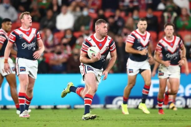 Ben Thomas of the Roosters runs the ball during the round 24 NRL match between the Sydney Roosters and the South Sydney Rabbitohs at Suncorp Stadium...