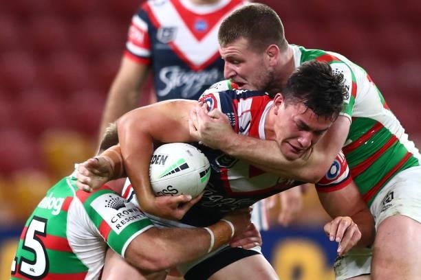Joseph Manu of the Roosters is tackled during the round 24 NRL match between the Sydney Roosters and the South Sydney Rabbitohs at Suncorp Stadium on...